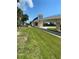 Architectural bridge over a road, surrounded by palm trees and greenery at 523 Park Estates Sq, Venice, FL 34293