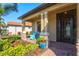 Inviting foyer with a decorative front door, round rug, and stylish console table at 10466 Medjool Dr, Venice, FL 34293