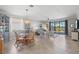 Open floorplan featuring a living room and dining area with scenic water view at 10466 Medjool Dr, Venice, FL 34293