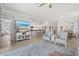 Spacious living room featuring neutral walls, open floor plan, and tile floors at 10466 Medjool Dr, Venice, FL 34293