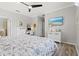 Spacious main bedroom featuring calming decor, and a workspace on the side wall at 10466 Medjool Dr, Venice, FL 34293