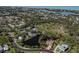 Beautiful aerial view of a property bordering a scenic pond at 1093 Laurel Woods Dr, Nokomis, FL 34275