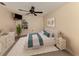 Comfortable bedroom with soft carpet, neutral colored walls, and decorative light fixture at 1093 Laurel Woods Dr, Nokomis, FL 34275