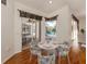 Bright dining area with sliding glass doors leading to the pool and outdoor space at 1093 Laurel Woods Dr, Nokomis, FL 34275