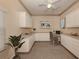 Cozy home office featuring custom cabinets, a built-in desk, and decorative accents at 1093 Laurel Woods Dr, Nokomis, FL 34275