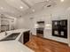 Modern kitchen with stainless steel appliances, white cabinets, and quartz countertops with a large island at 1093 Laurel Woods Dr, Nokomis, FL 34275