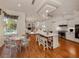 Open concept kitchen and living room with island seating and patio access at 1093 Laurel Woods Dr, Nokomis, FL 34275