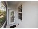 Charming front entrance with decorative glass door and 'Welcome Home' mat at 11915 Tempest Harbor Loop, Venice, FL 34292