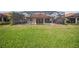 Spacious backyard featuring a screened-in pool and a covered patio at 133 Treviso Ct, North Venice, FL 34275
