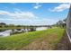 Scenic backyard with a tranquil lake view at 133 Treviso Ct, North Venice, FL 34275