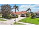 Charming single-story home boasting a well-maintained lawn, mature landscaping, and a private two-car garage at 133 Treviso Ct, North Venice, FL 34275