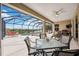 Enjoy this screened-in pool and lanai overlooking a tranquil lake, ideal for outdoor entertaining and relaxation at 133 Treviso Ct, North Venice, FL 34275