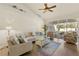 Bright living room with comfortable seating, neutral walls, and access to a screened-in patio, enhancing indoor-outdoor living at 1537 Monarch Dr, Venice, FL 34293