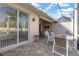 Outdoor patio with comfortable seating and views of the screened-in lanai, offering a peaceful space to relax at 1537 Monarch Dr, Venice, FL 34293