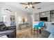 Cozy living room with an entertainment center, comfortable seating, and an inviting color scheme at 174 Southampton S Pl # 345, Venice, FL 34293