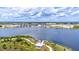 Picturesque lake view with a lakeside path and dock creating a serene and inviting atmosphere at 19832 Bridgetown Loop, Venice, FL 34293