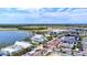Aerial view of a waterfront community, featuring modern buildings and beautiful landscaping at 19832 Bridgetown Loop, Venice, FL 34293
