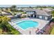 Aerial view showcasing the community pool, outdoor lounge area, and other neighborhood amenities at 19832 Bridgetown Loop, Venice, FL 34293