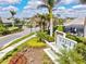 Well-maintained community entrance features professional landscaping, a water feature, and a welcoming sign at 19832 Bridgetown Loop, Venice, FL 34293