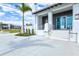 Exterior view of building, showcasing the entrance with stairs, railing, and modern architectural details at 19832 Bridgetown Loop, Venice, FL 34293