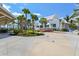 Exterior view showcasing modern architecture and lush landscaping in a serene setting at 19832 Bridgetown Loop, Venice, FL 34293