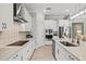 Sleek kitchen featuring stainless steel appliances and stone countertops at 19832 Bridgetown Loop, Venice, FL 34293