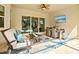 Inviting lanai with a seating area, dining table, and a view of the pool, ideal for outdoor living at 19832 Bridgetown Loop, Venice, FL 34293