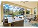 Covered patio with outdoor seating and views of the screened pool at 19832 Bridgetown Loop, Venice, FL 34293