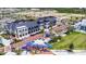 Overhead view of the community, showcasing the buildings, brick-paved street, and lush landscaping at 19832 Bridgetown Loop, Venice, FL 34293