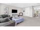 Bonus room featuring neutral carpeting, ample lighting, and comfortable seating at 19836 Bridgetown Loop, Venice, FL 34293