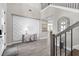 Grand foyer boasting wood-look tile flooring, a unique accent wall, and a modern console table at 19836 Bridgetown Loop, Venice, FL 34293