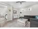 Open-concept living room with seamless transition to the kitchenette and a cozy seating area at 19836 Bridgetown Loop, Venice, FL 34293