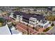 Aerial shot of Wellen Park's shopping district, featuring brick-paved streets and a variety of shops and restaurants at 19836 Bridgetown Loop, Venice, FL 34293