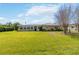 Large backyard with Florida glass room and ample space for outdoor activities at 407 Rubens Dr, Nokomis, FL 34275