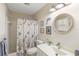 Charming bathroom with nautical themed decor, vanity, and shower at 407 Rubens Dr, Nokomis, FL 34275