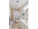 Bright bathroom with vanity, nautical themed decor, and shower at 407 Rubens Dr, Nokomis, FL 34275