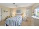 Comfortable bedroom featuring neutral tones, soft lighting, and a comfortable queen size bed at 407 Rubens Dr, Nokomis, FL 34275