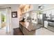 Updated kitchen features granite countertops, stainless steel appliances, and breakfast bar at 407 Rubens Dr, Nokomis, FL 34275