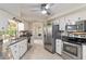 Bright kitchen features granite countertops, stainless steel appliances, and ample storage at 407 Rubens Dr, Nokomis, FL 34275