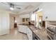 Modern kitchen with granite countertops, stainless steel appliances, and ample storage at 407 Rubens Dr, Nokomis, FL 34275