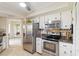 Modern kitchen featuring stainless steel appliances, and ample cabinet space at 407 Rubens Dr, Nokomis, FL 34275