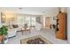Comfortable living room with white couches, a patterned rug, and lots of natural light at 407 Rubens Dr, Nokomis, FL 34275