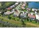 Aerial view of the property and surrounding neighborhood with tree lined street at 408 Otter Creek Dr, Venice, FL 34292