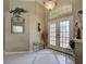 Lovely home foyer with a neutral color palette, high ceilings and tile flooring at 408 Otter Creek Dr, Venice, FL 34292