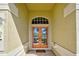 Front entrance to the home showcasing the double doors, transom window and neutral decor at 408 Otter Creek Dr, Venice, FL 34292