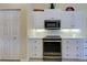 Kitchen featuring oven and stainless appliances at 408 Otter Creek Dr, Venice, FL 34292