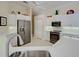 Kitchen featuring stainless refrigerator and white cabinets at 408 Otter Creek Dr, Venice, FL 34292