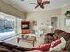 Relaxing living room with a ceiling fan, tile floors, and sliding glass doors to the lanai at 408 Otter Creek Dr, Venice, FL 34292