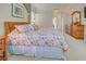 Spacious main bedroom showcases a wooden dresser and light-filled interior at 408 Otter Creek Dr, Venice, FL 34292