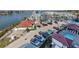 Aerial view of the community with a pool, parking, and boat docks at 501 Tamiami N Trl # 502, Venice, FL 34285
